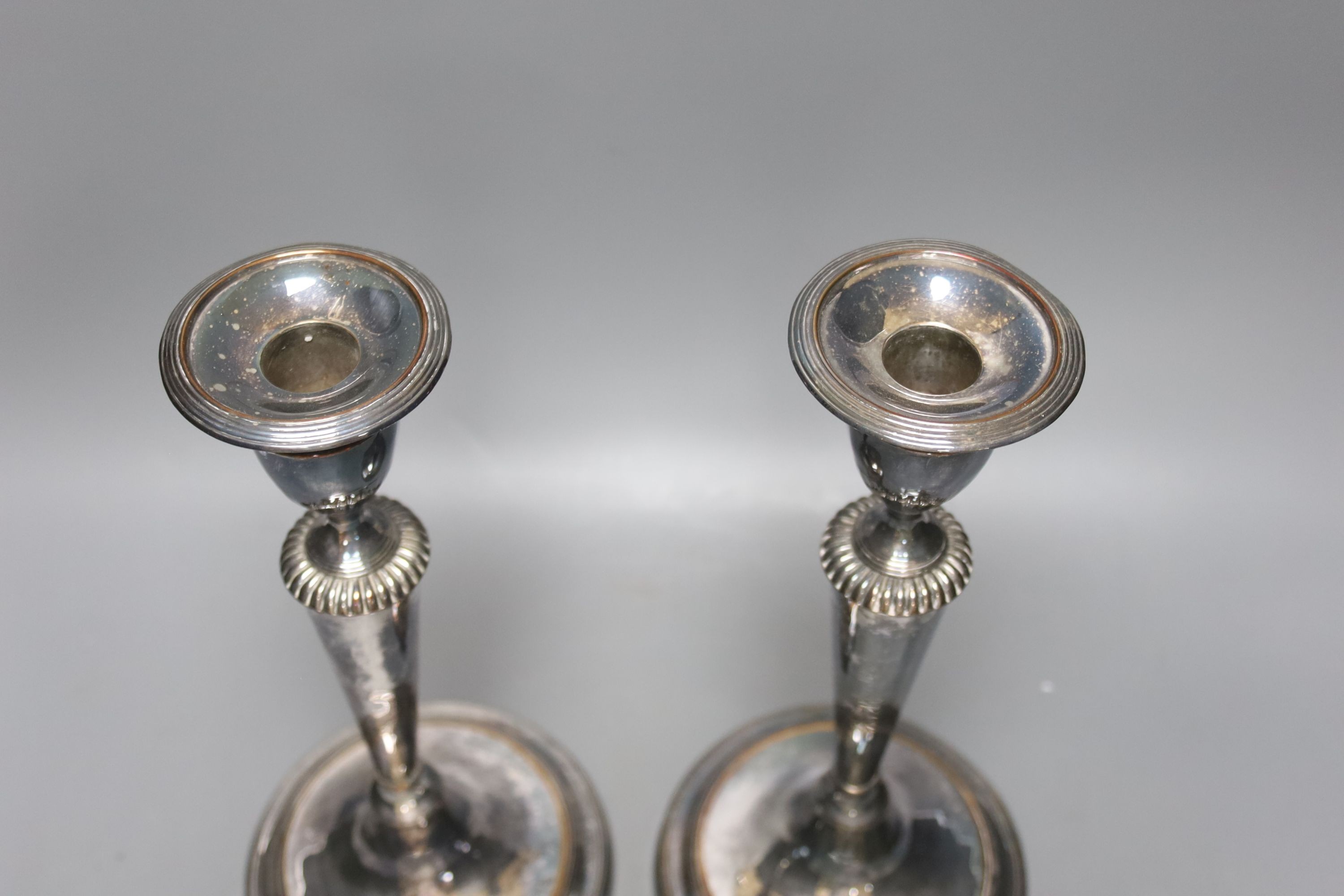 A pair of silver plated candlesticks, height 29cm